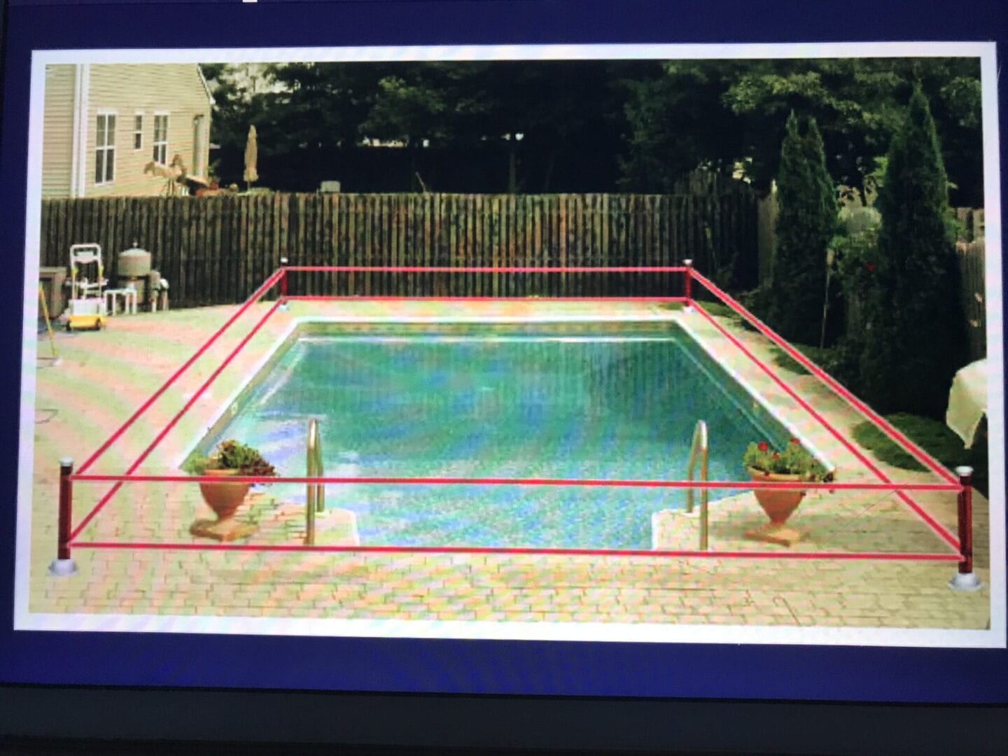 A pool with red lines on the side of it.