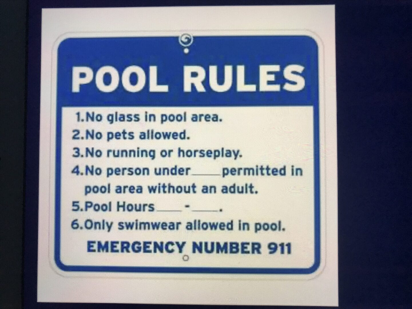 A sign that says pool rules and emergency number 9 1 1.