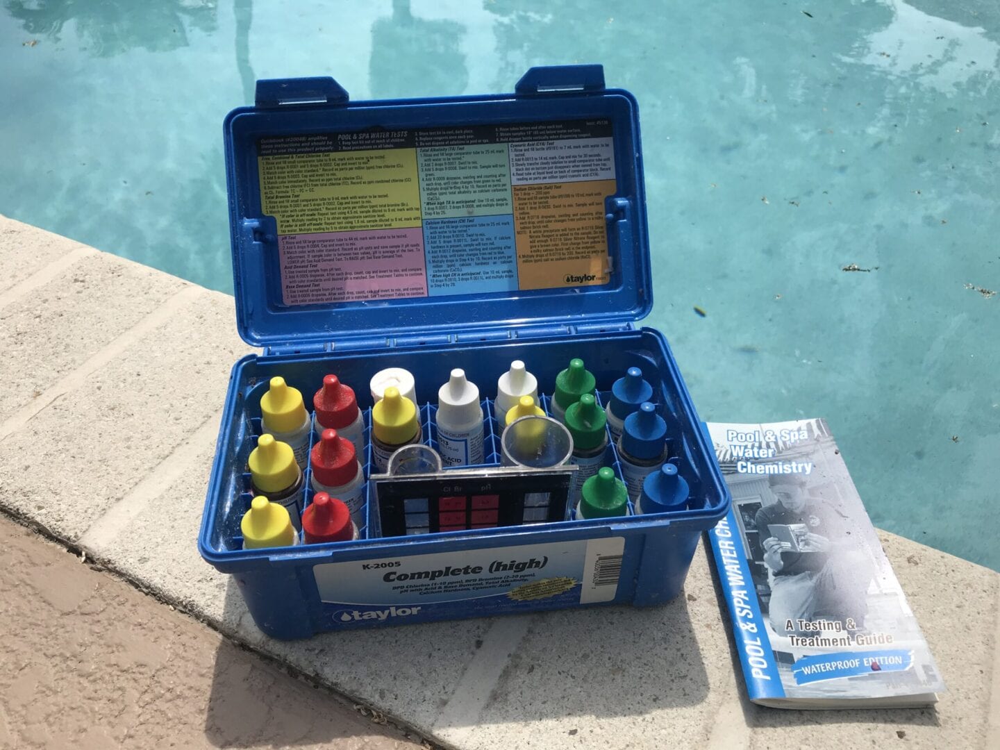 A blue box with many different colors of paint.