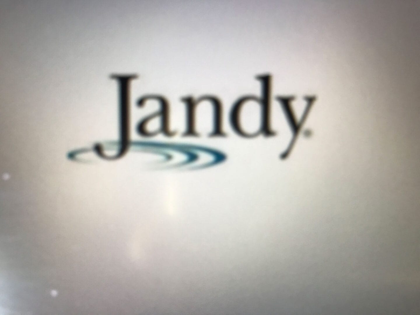 A close up of the jandy logo on a wall