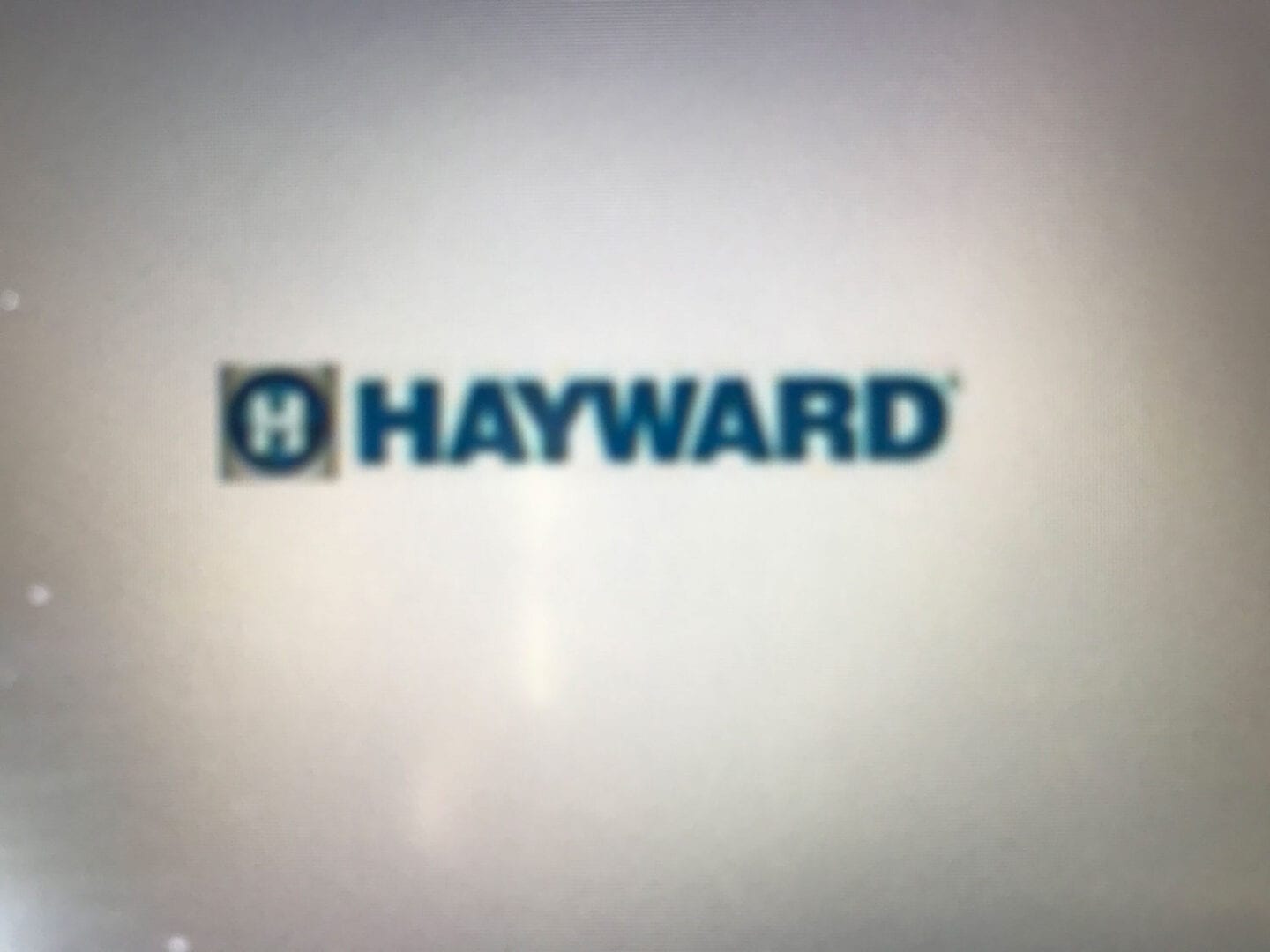 A hayward logo is shown on the side of a wall.