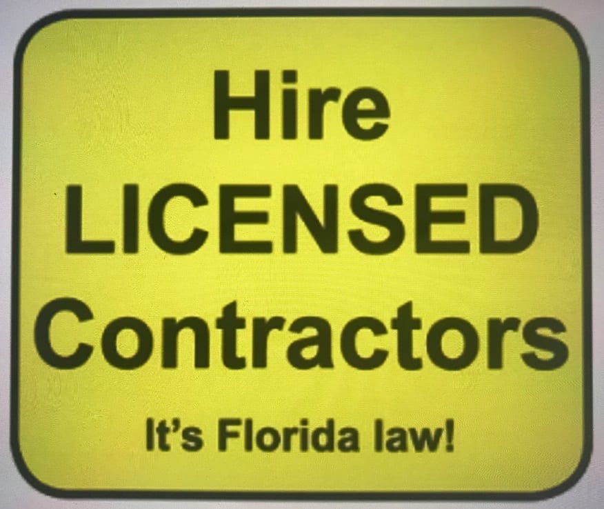 A yellow sign that says hire licensed contractors.