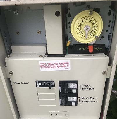 A close up of the electrical box with an electric meter on it.