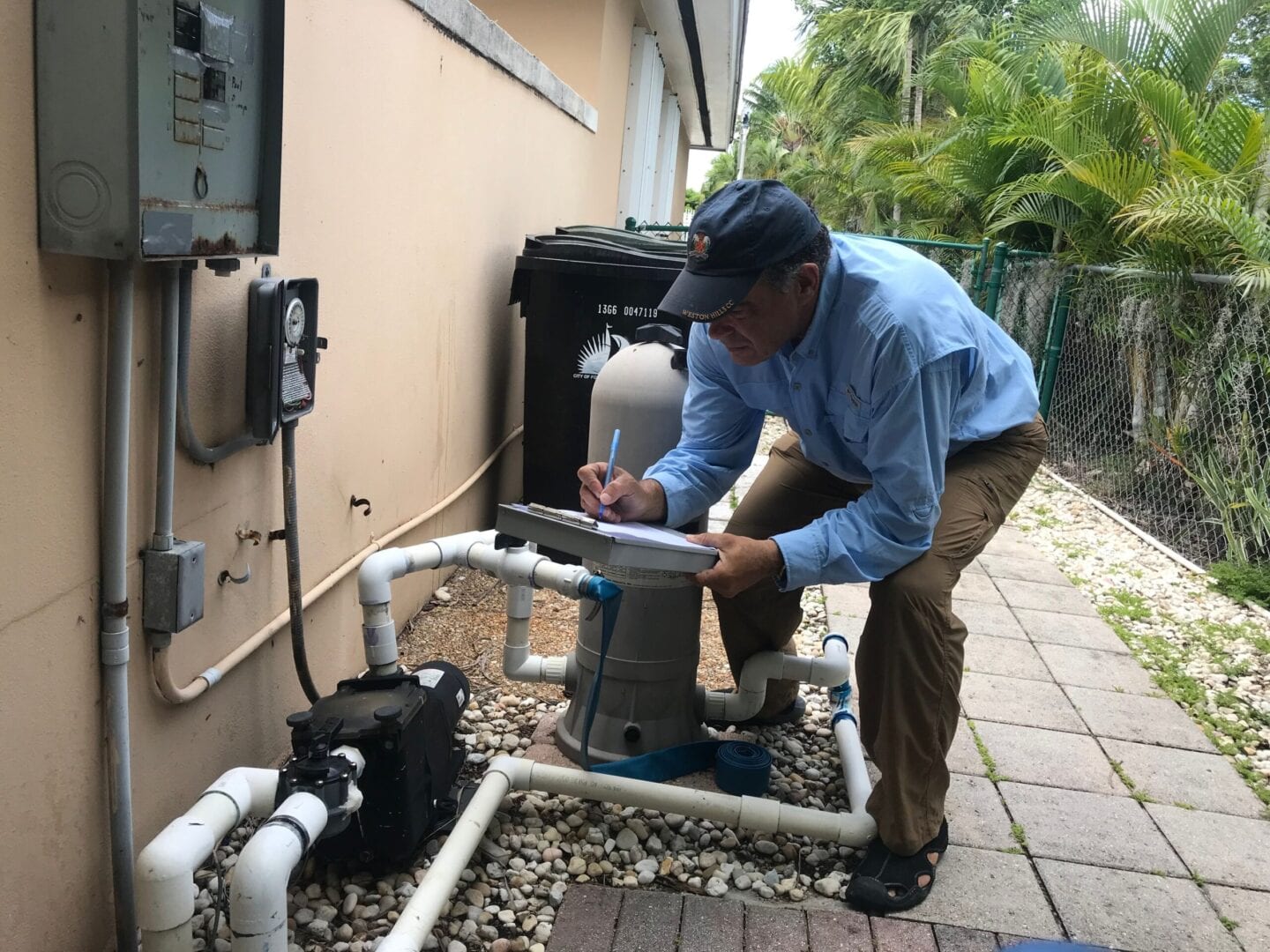 A man working on an outdoor unit.