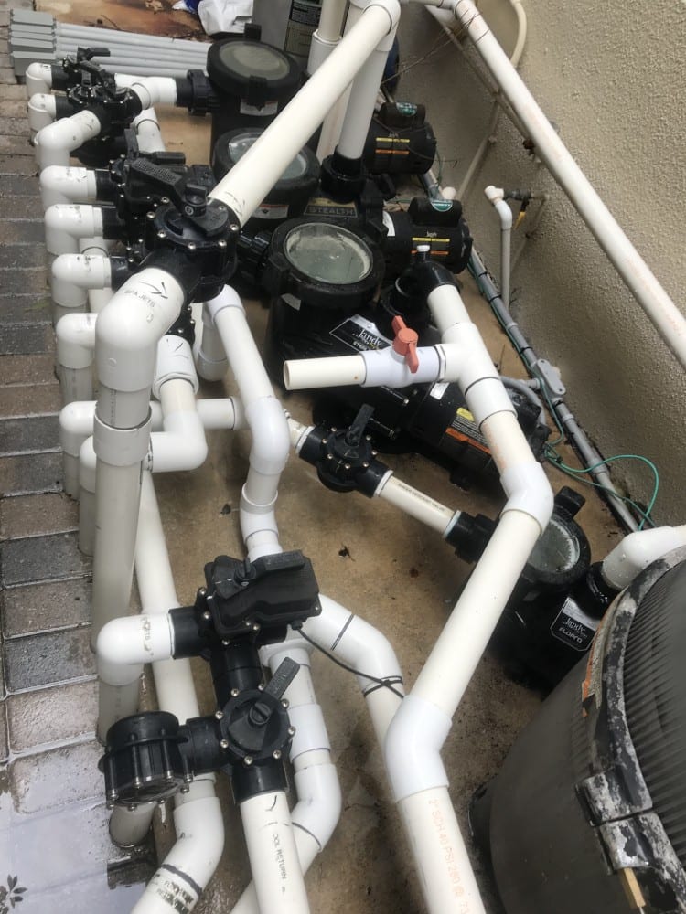 Pool plumbing system, white pipes