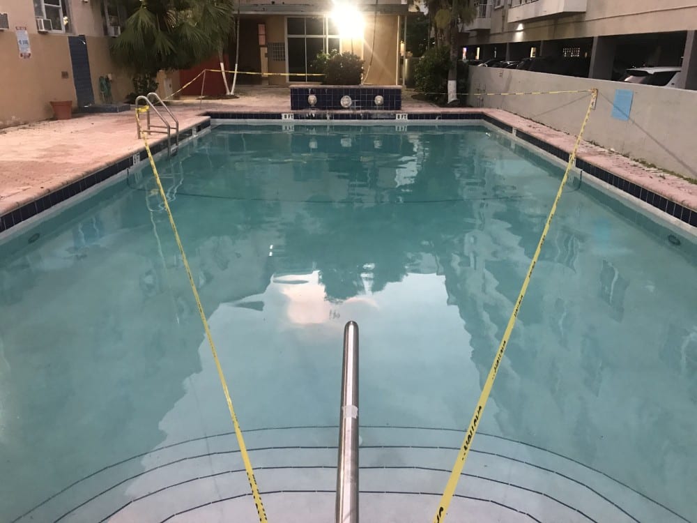 Rectangular pool with yellow warning tape