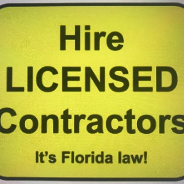 A yellow sign that says hire licensed contractors.